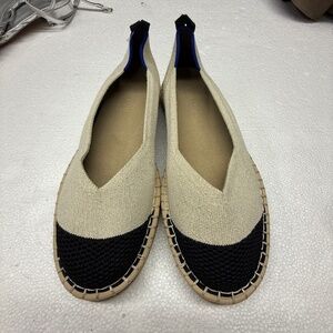 Rothy's The Espadrille Boardwalk shoes in a cream and black colorway.